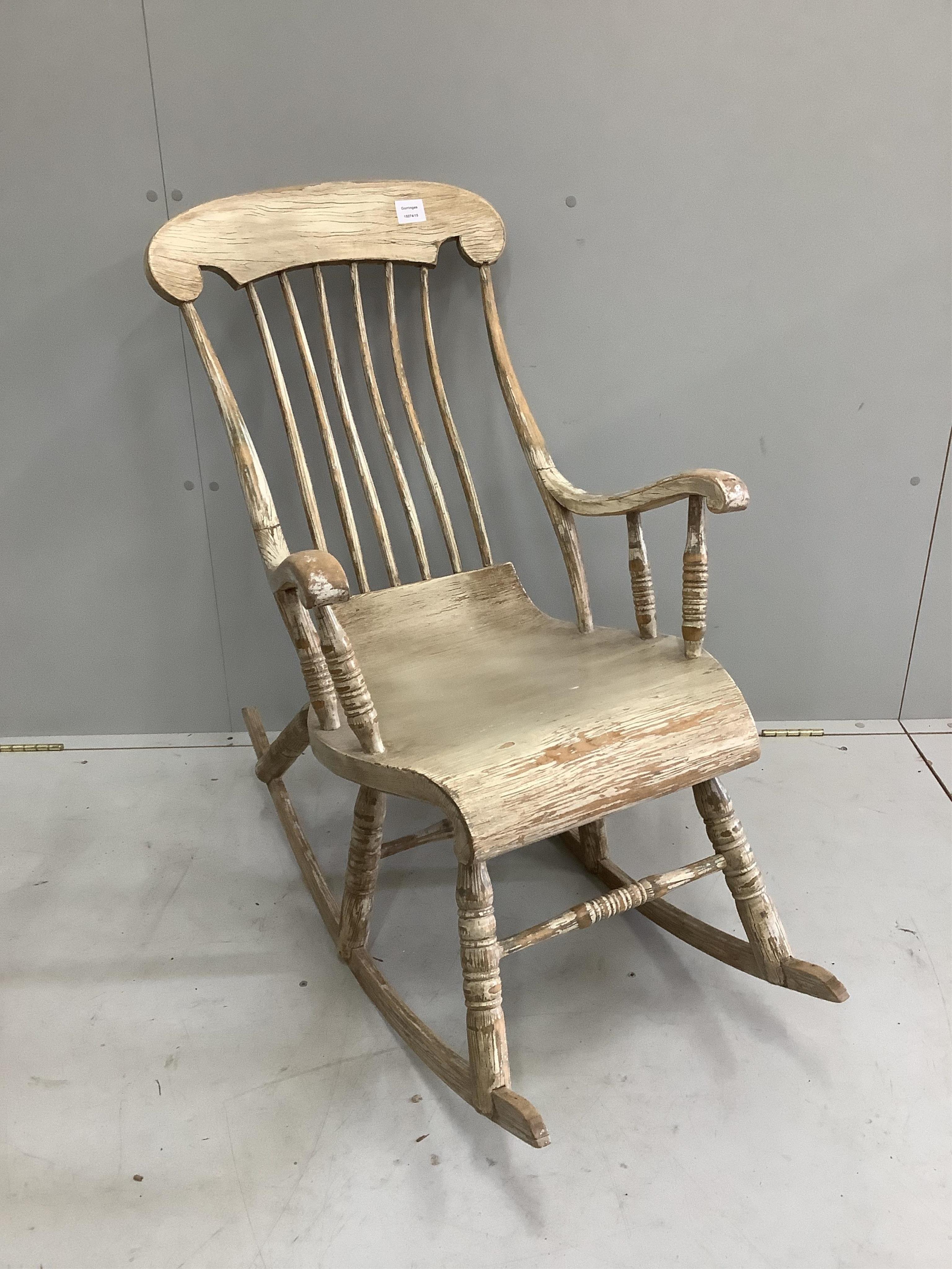 An American style painted pine rocking chair, width 56cm, depth 96cm, height 94cm. Condition - good